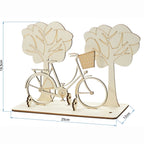 Holz-Fahrrad-Geldgeschenk mit Maßangaben: 25 cm breit, 19,5 cm hoch, 12 cm tief